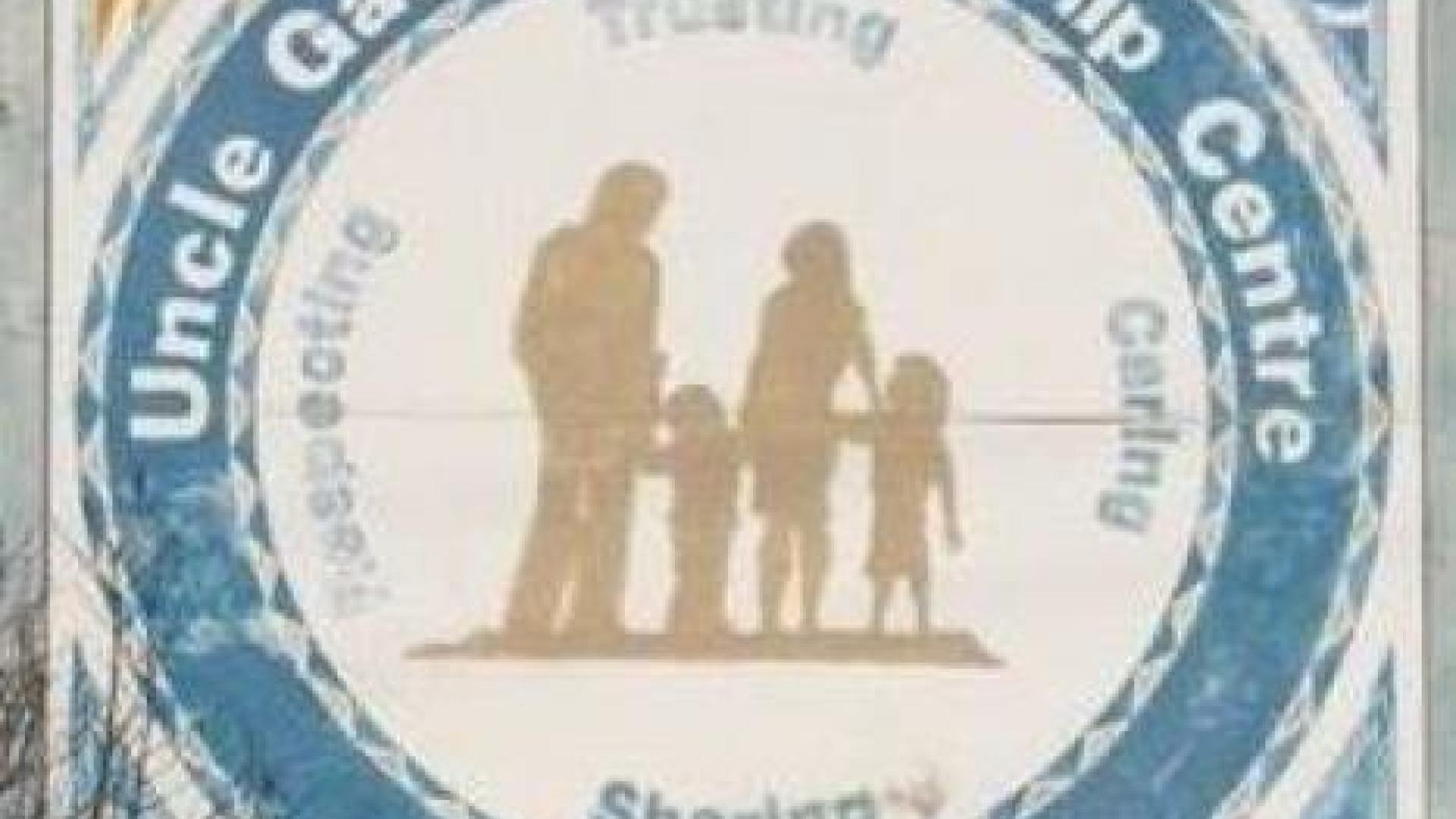 Logo for Uncle Gabe's Friendship Centre. There is a silhouette of a man, a woman, and two children holding hands.