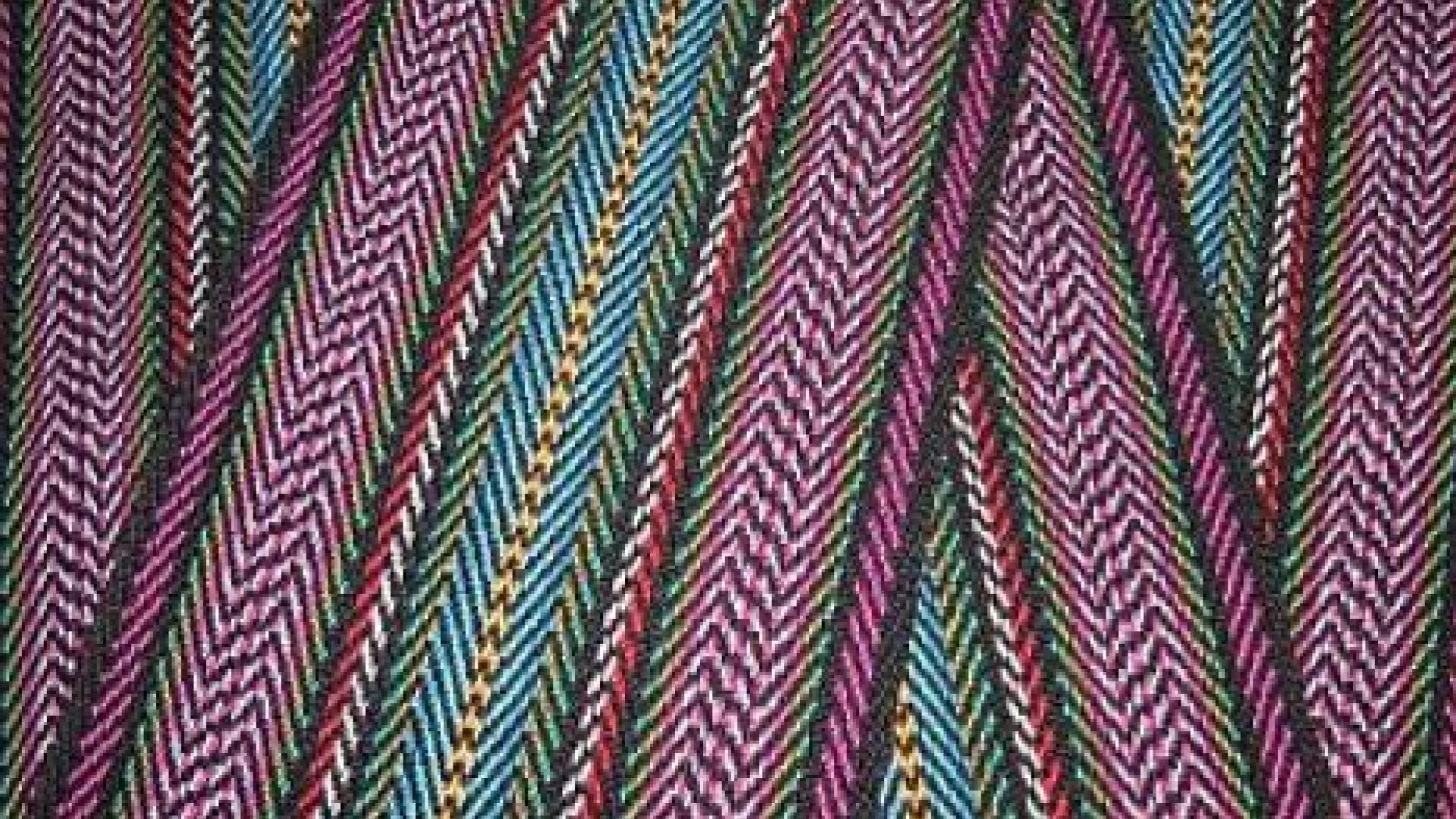 closeup of purple, blue, and yellow patterned cloth.