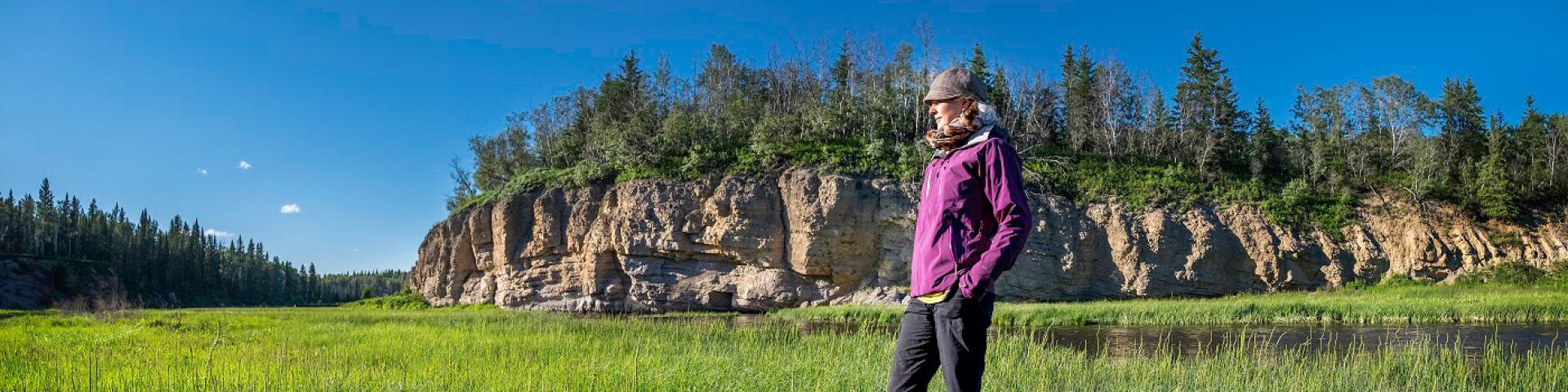 A person standing in a grassy field