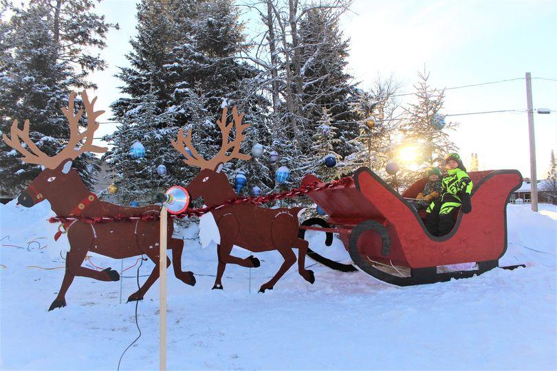 kids in santa's slay and mock reindeer