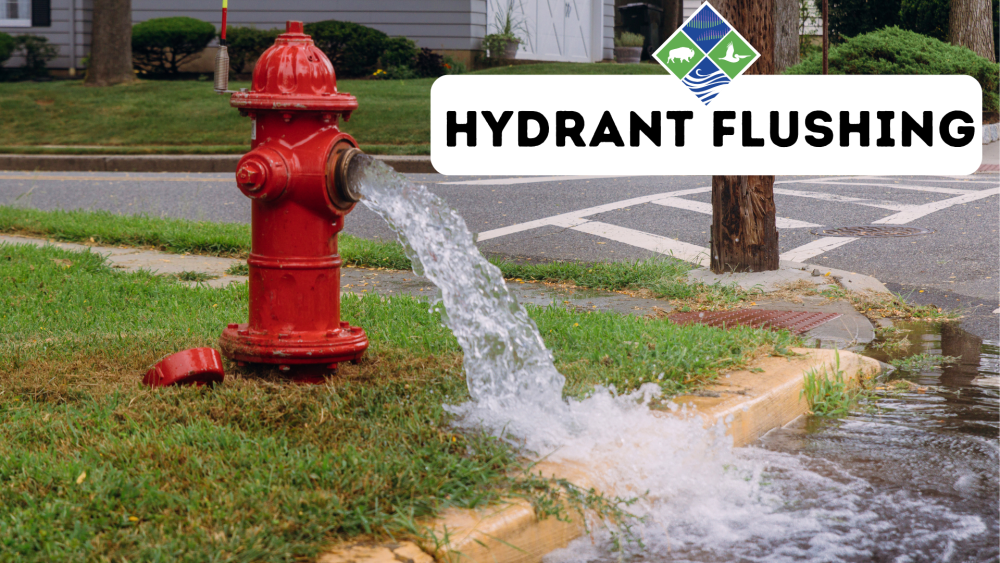 open fire hydrant with the words Hydrant Flushing in a block neck to it